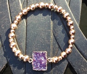 Rose gold plated with purple resin stone