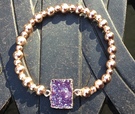 Rose gold plated with purple resin stone - Image 1